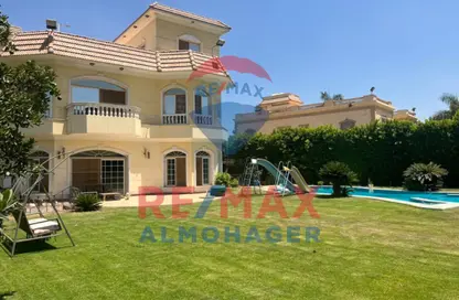 Villa - 7 Bedrooms - 5 Bathrooms for rent in Mena Garden City - Al Motamayez District - 6 October City - Giza