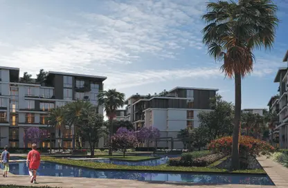 Apartment - 3 Bedrooms - 2 Bathrooms for sale in Tesla Residence - Al Wahat Road - 6 October City - Giza