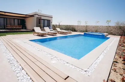 Villa - 4 Bedrooms - 4 Bathrooms for sale in Beit Al Bahr - Sidi Heneish - North Coast