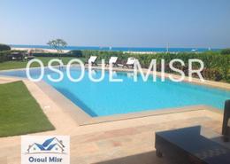 Villa - 4 bedrooms for للبيع in Long Beach - Al Alamein - North Coast