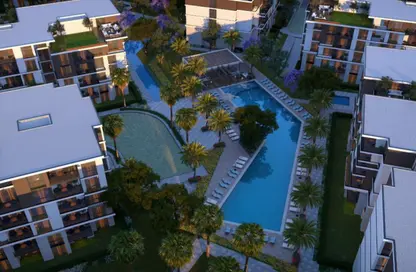 Apartment - 2 Bedrooms - 2 Bathrooms for sale in Tesla Residence - Al Wahat Road - 6 October City - Giza