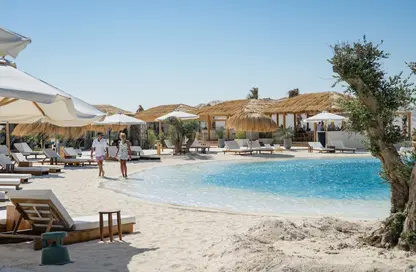 Chalet - 2 Bedrooms - 2 Bathrooms for sale in Ramla Lakeside - Qesm Ad Dabaah - North Coast