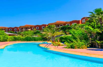Chalet - 2 Bedrooms - 2 Bathrooms for sale in Bungalows - Markaz Al Hamam - North Coast