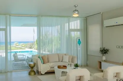 Chalet - 2 Bedrooms - 2 Bathrooms for sale in Ramla Lakeside - Qesm Ad Dabaah - North Coast